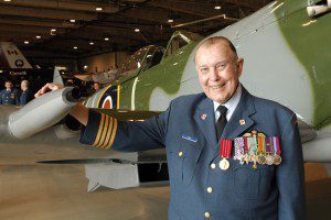 Hon. Col. Charley Fox with a Spitfire like one he flew on D-Day.