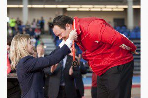 Dylan Armstrong receives Olympic Games bronze medal from Heyley Wickenheiser at Kamloops ceremony. (Toronto Star)