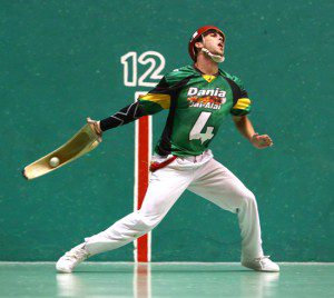 Staff Photo / Joe Rondone Daniel Spinner winds up his cesta to whip the pelota at Dania Jai-Alai during a matinee match on July 19, 2014. Spinner, a Boca Raton resident, is one of the few pro U.S. players within the sport of jai-alai and is playing for a permanent roster spot at the historic Dania fronton.