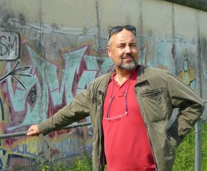 Rene at the Berlin Wall, during our scouting trip across Germany - he never appeared fully at ease in such places.